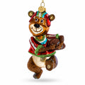 Football-themed bear glass Christmas ornament with hanging gold loop and multicolor outfit