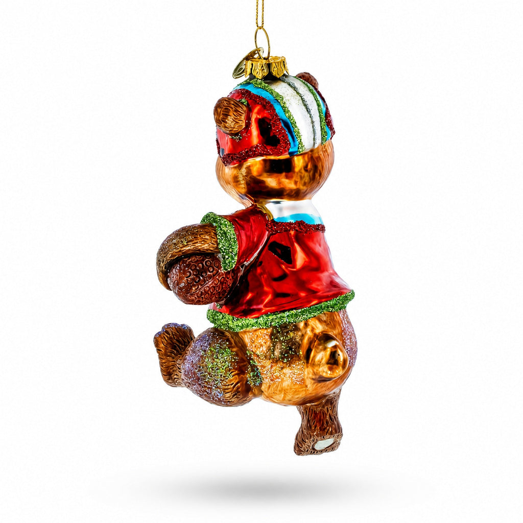 Football-themed bear glass Christmas ornament, back view with multicolor uniform and gold loop