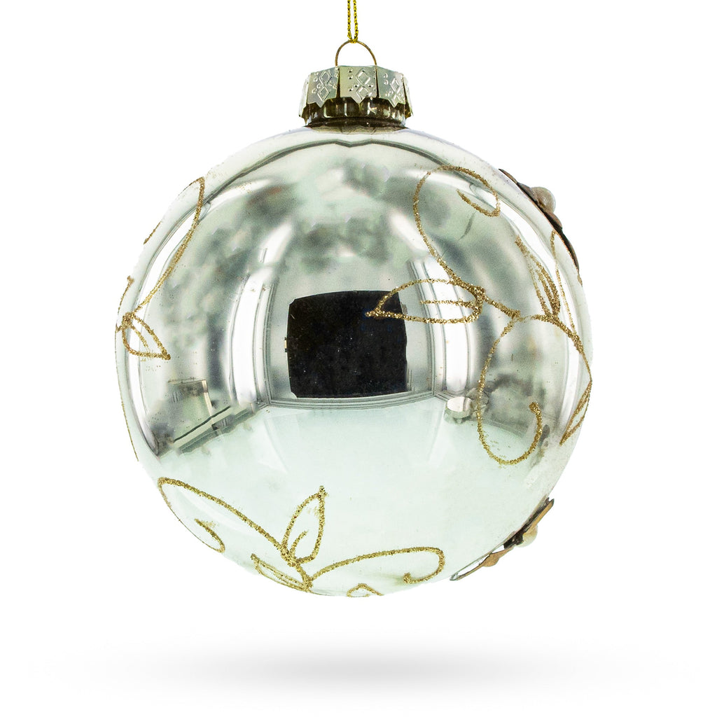 Clear glass Christmas ornament ball with gold vine detailing and hanging loop