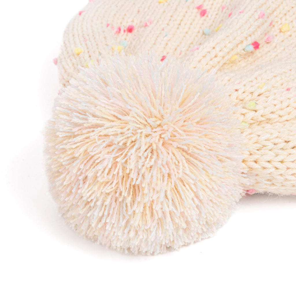 Cream knit mitten cuff with fluffy pom-pom and pastel speckled knit