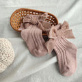 Mauve wool tube socks with large bowknot cuffs