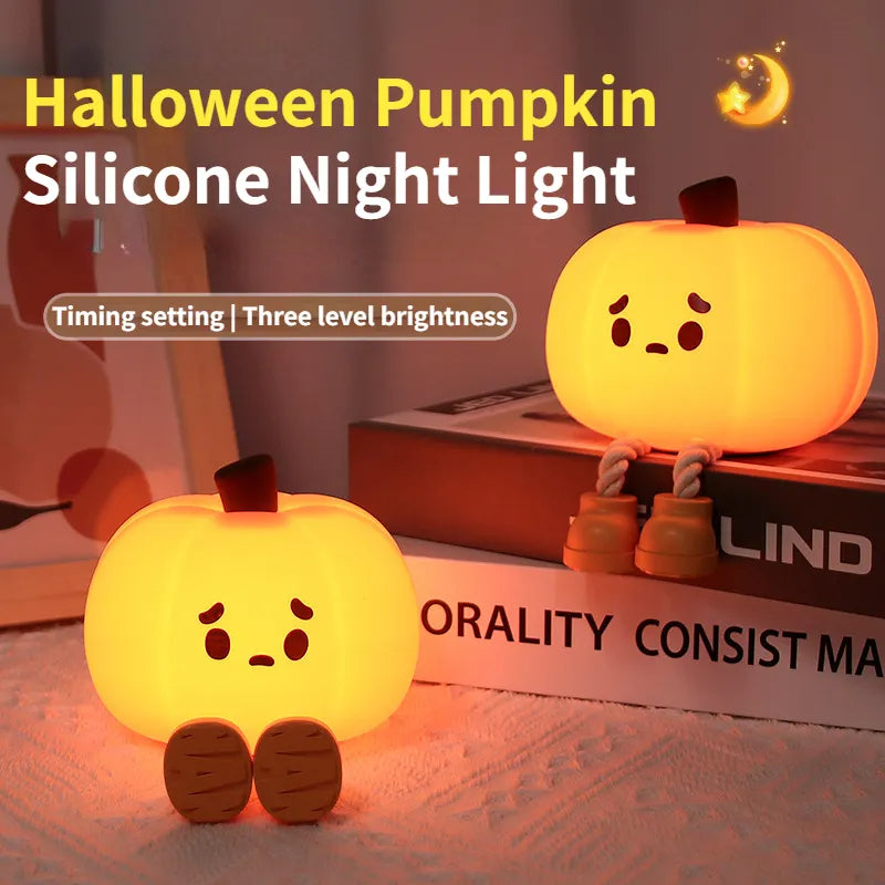 Soft silicone pumpkin night light with sad face, warm glow on bedside table