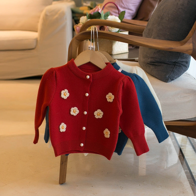 Red children's cardigan sweater with flower appliques and button front