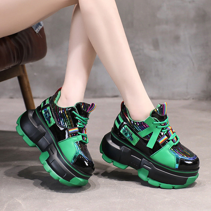 Green lace-up chunky platform sneakers with rainbow laces and black side straps