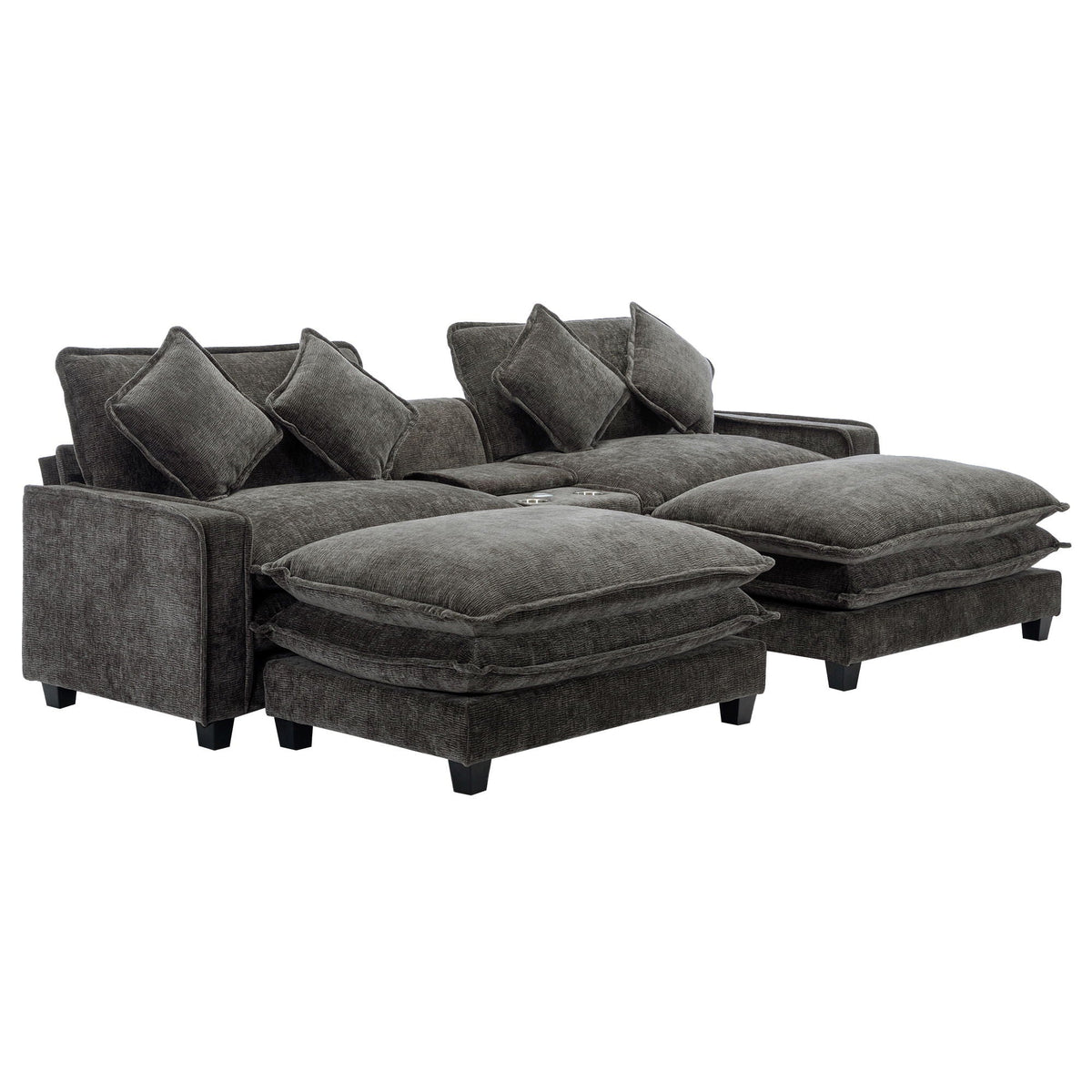 Dark gray sectional sofa with extended ottoman seats and multiple back throw pillows