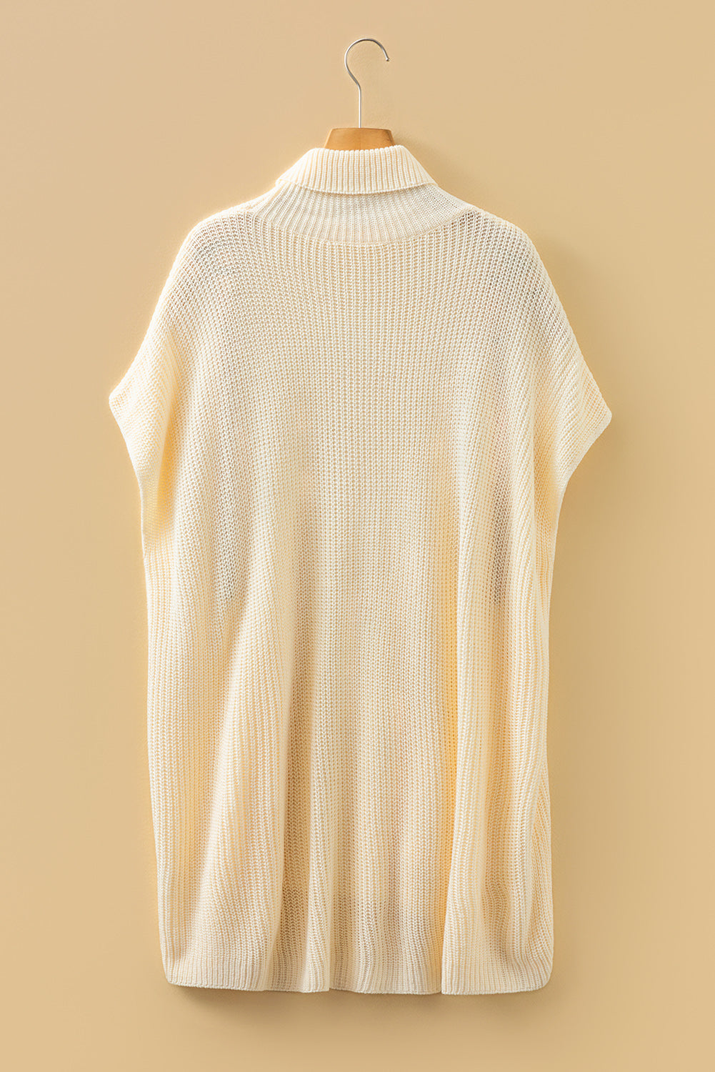 Cream turtleneck short-sleeve tunic sweater on hanger, pullover style