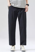 Men's black cropped loose-fit pants with straight legs