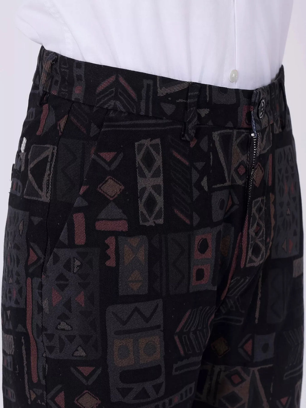 Men's black printed casual pants with all-over geometric pattern and belt loops