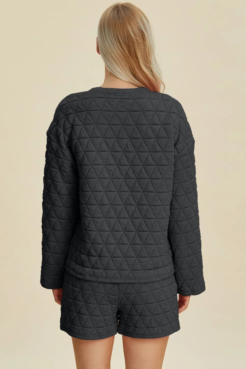 Textured black long-sleeve top and matching shorts set, back view, diamond quilt
