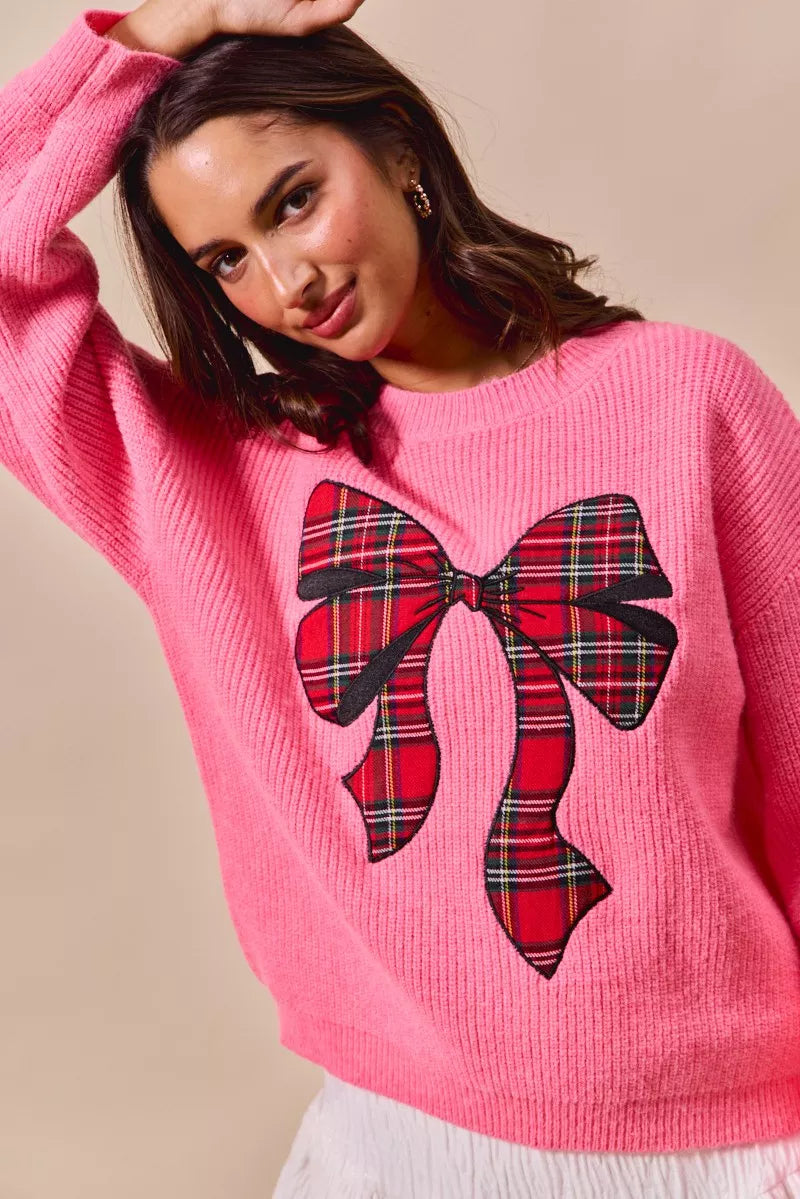 SO ME pink holiday sweater with ribbed knit and plaid ribbon bow graphic