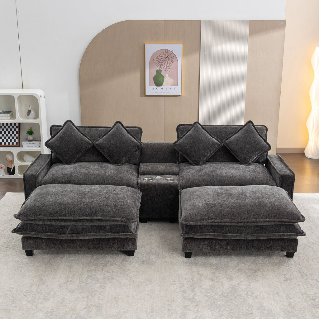 Dark gray sectional sofa with two removable ottomans in front and four back pillows