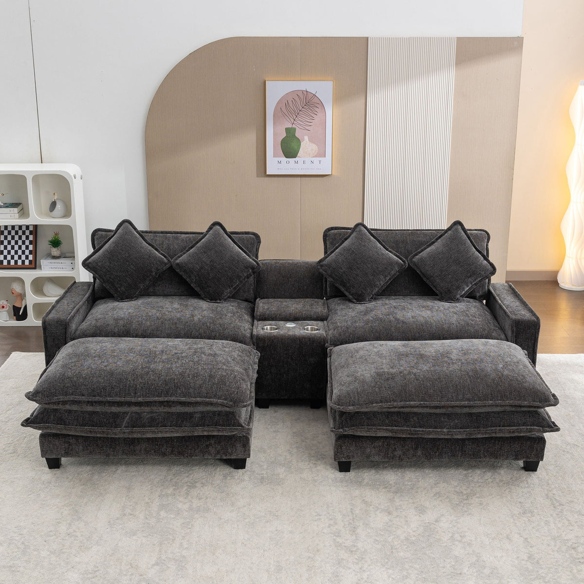 Dark gray sectional sofa with two removable ottomans in front and four back pillows