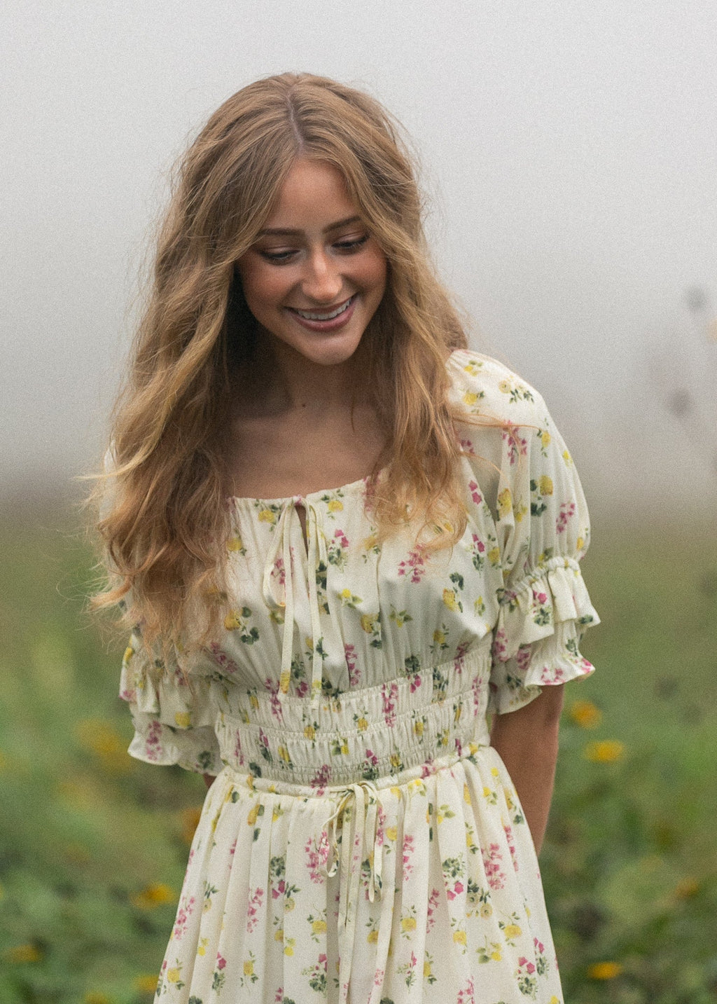 Ivory floral puff-sleeve maxi dress close-up with gathered neckline and waist