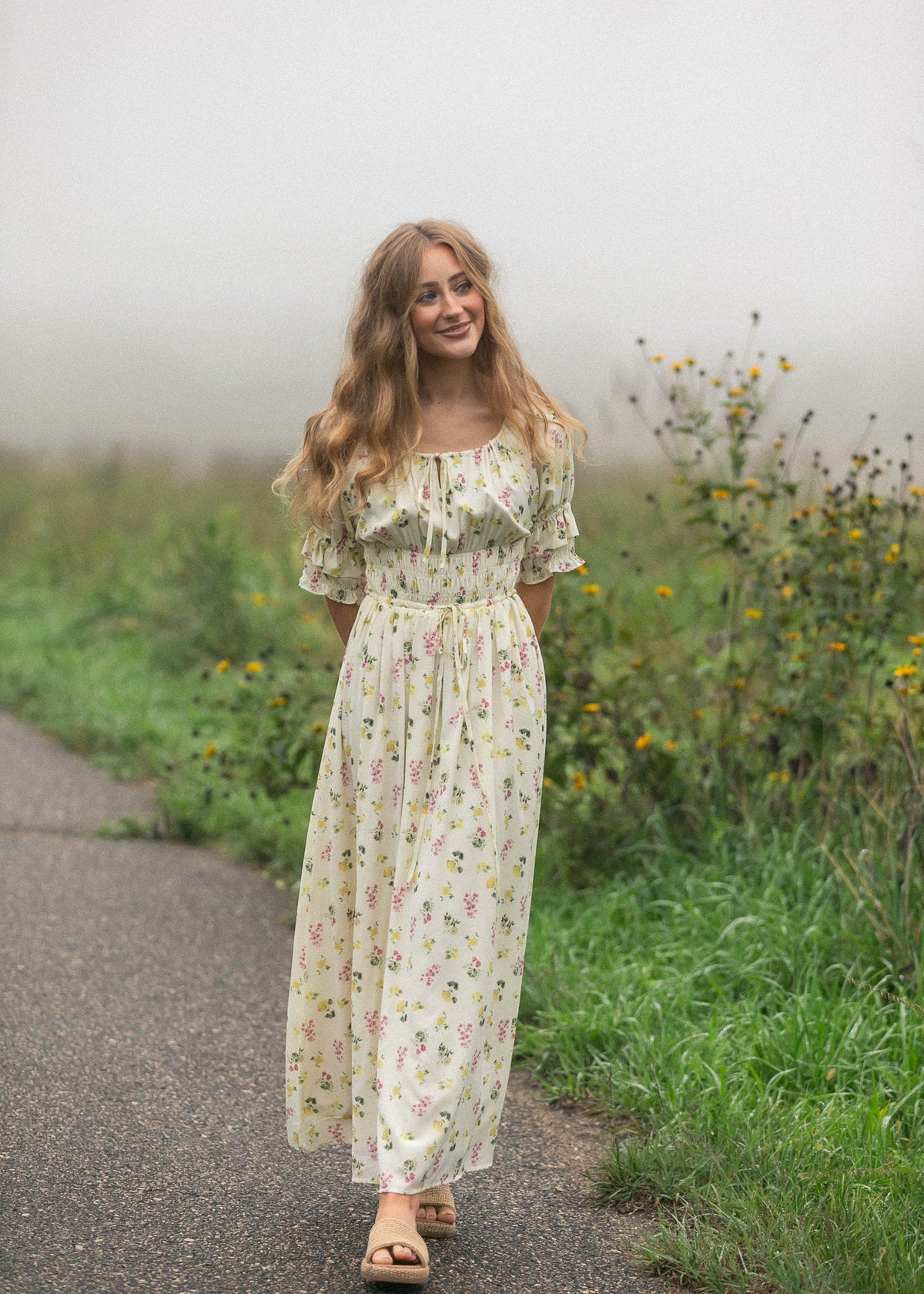 Ivory floral puff-sleeve maxi dress with smocked waist and flowing midi-maxi length