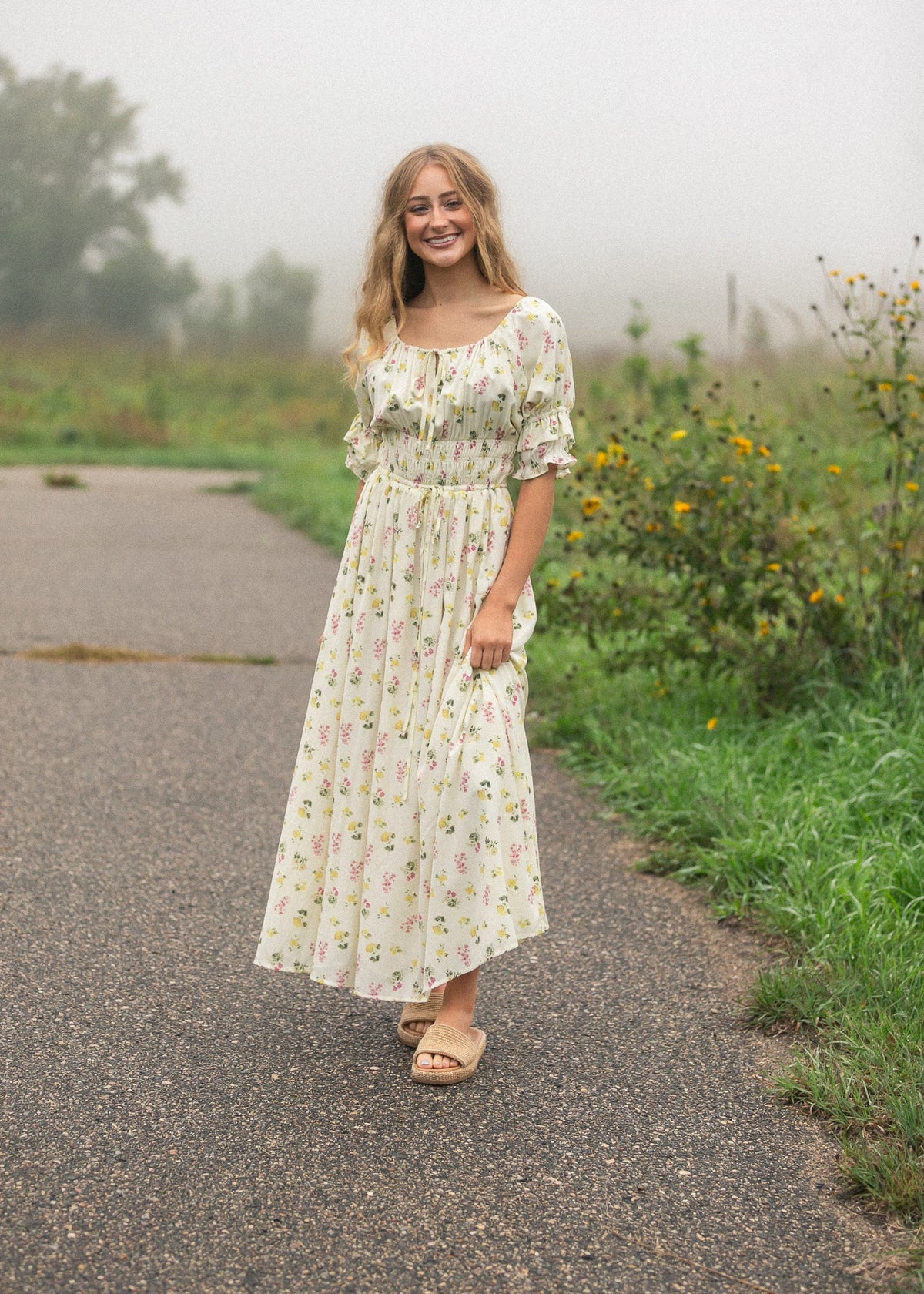 Ivory floral puff-sleeve maxi dress with elastic waist and swaying full skirt