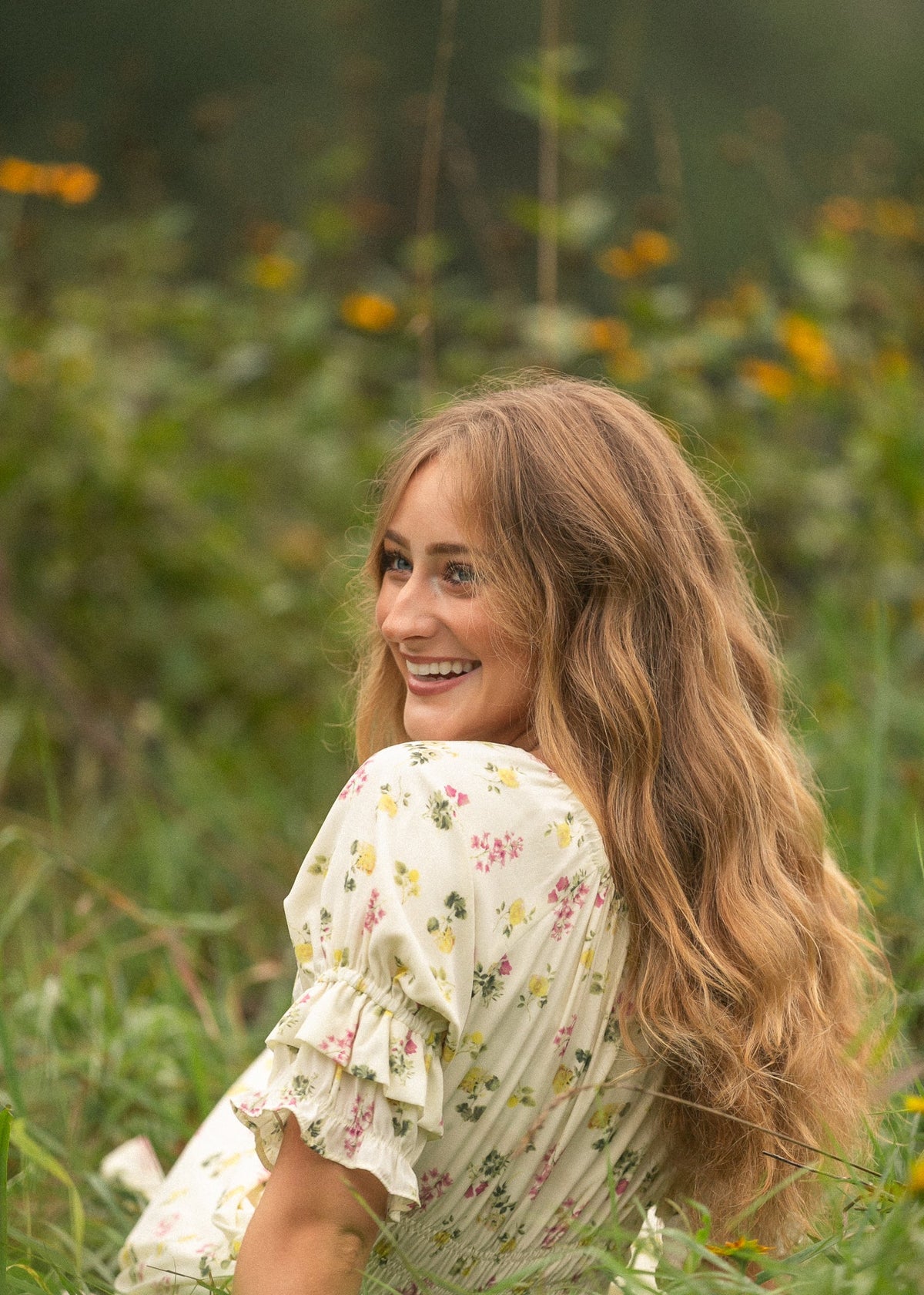 Cream floral puff-sleeve maxi dress in profile, showing ruffled sleeve hem.