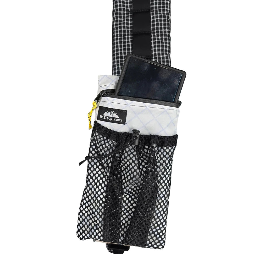 White and black cell phone pouch with zipper, holding a phone on the strap