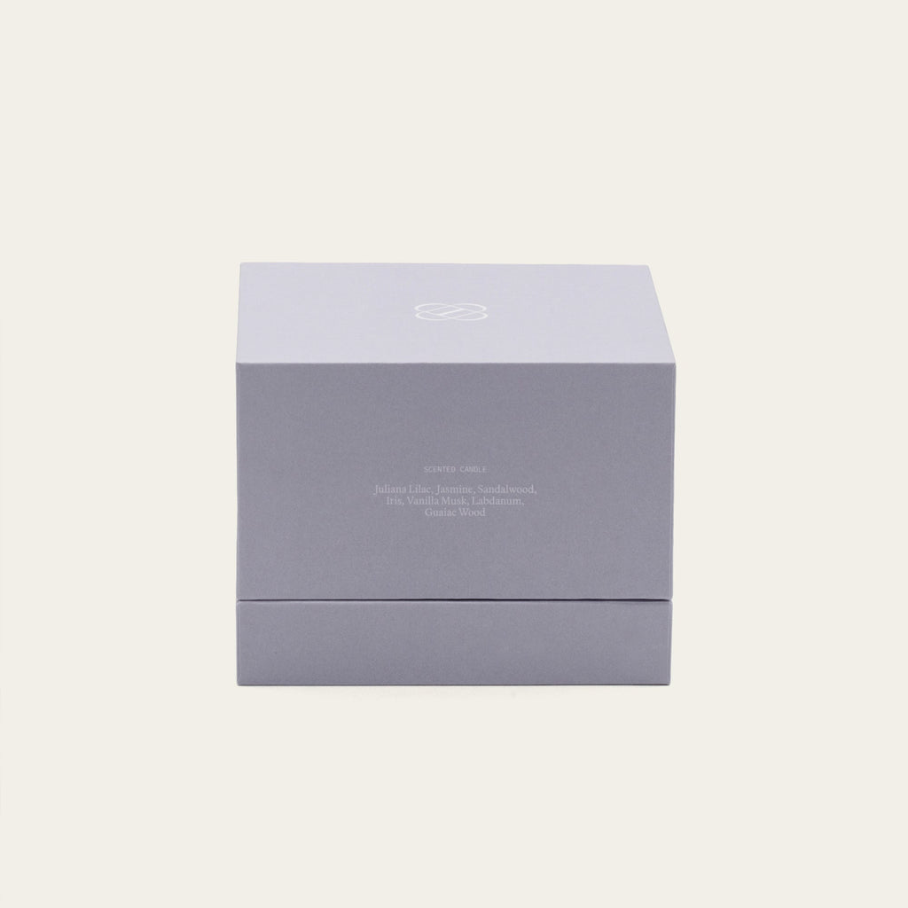 Lilac gift box for Lilac Mist ceramic soy candle, with brand logo on top.
