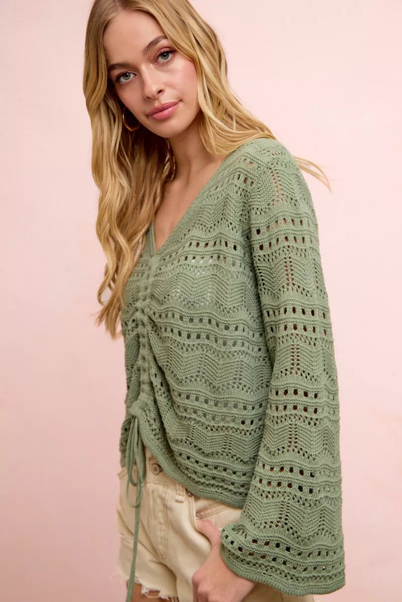 Sage green pointelle knit V-neck top with ruched gathered front and long sleeves