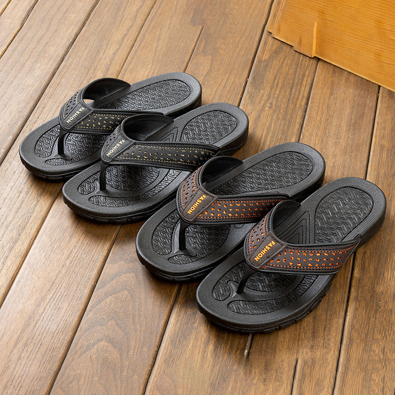 Set of black men’s flip-flop sandals with orange perforated strip and grippy textured footbeds
