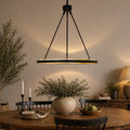 Adjustable round LED chandelier with black tripod rods and glowing ring light