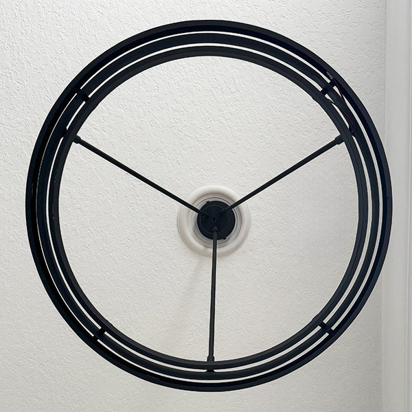 Round LED chandelier close-up: black circular frame with ring-shaped LED lights