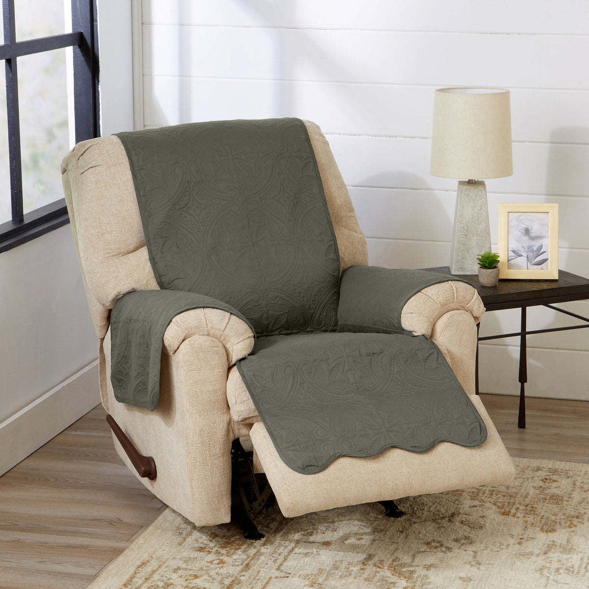 Medallion solid armchair protector in sage green on cream upholstered chair