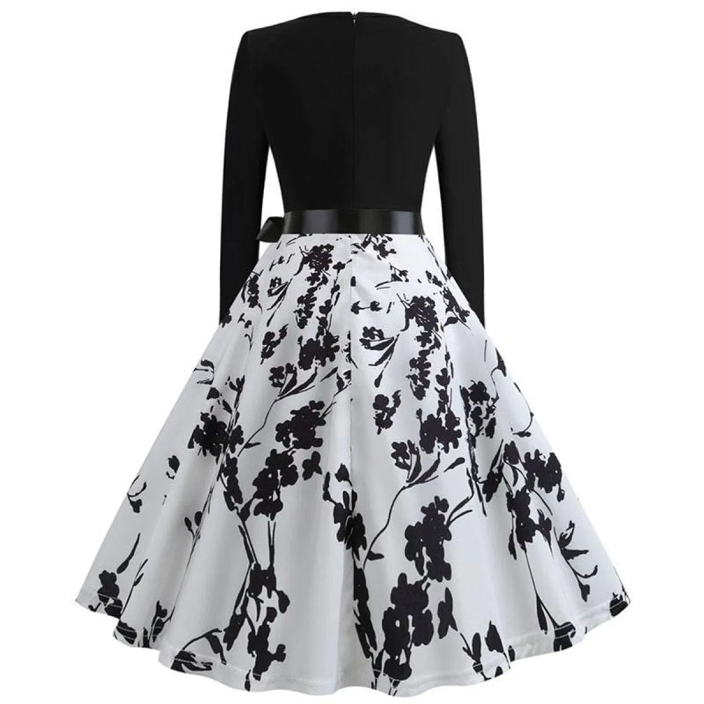 Women’s swing dress with black back bodice and white skirt with black floral print