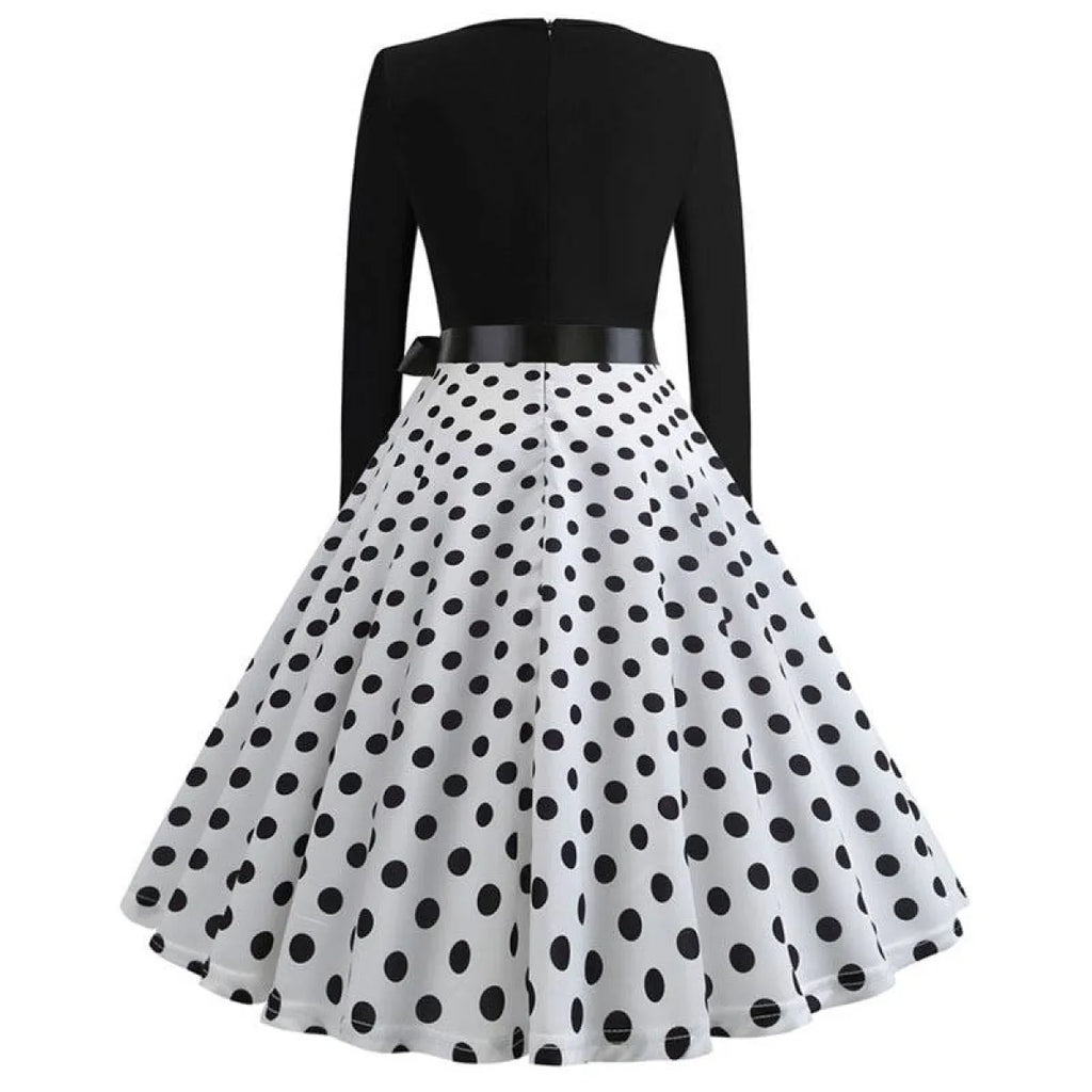Women’s swing dress with black back bodice and white skirt with black polka dots