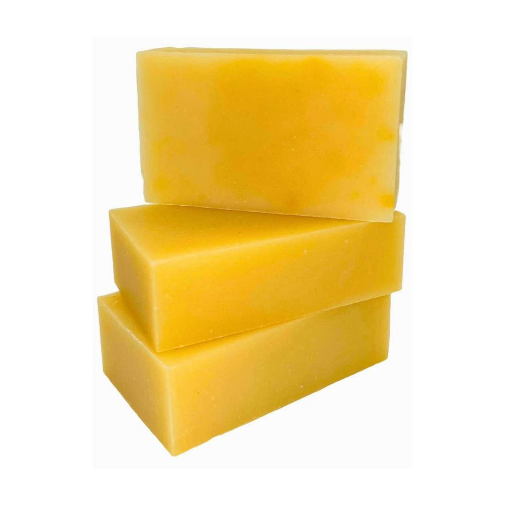 Yellow citrus shampoo bar, three stacked rectangular bars