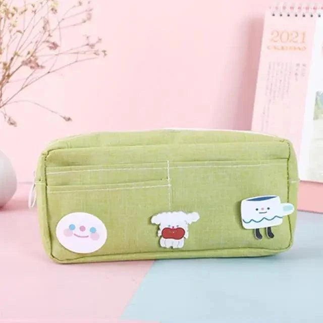 Light green fabric pencil pouch with cute cloud, sheep, and bear patches, zip closure