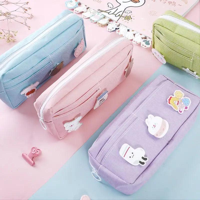 Set of pastel pencil pouches in blue, pink, and purple with cute animal patches