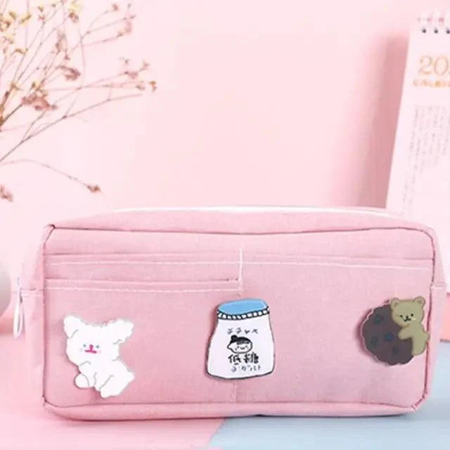 Pink fabric pencil pouch with cartoon bear and milk bottle patches, zip closure