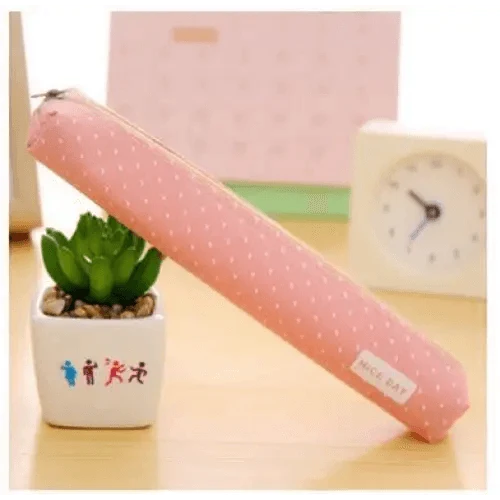 Pink dotted slim canvas pencil pouch with zipper and 'Nice day' label.