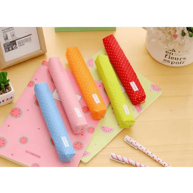 Assorted slim canvas pencil pouches with dotted prints and zipper closures in mixed colors.