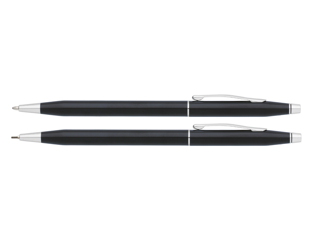 Black lacquer pen and pencil set with two pens lying side by side, silver clips