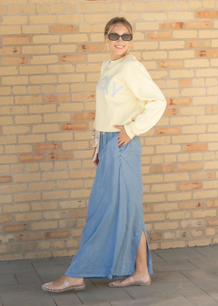 Medium-wash chambray maxi skirt with side slit and ruched drawstring waist