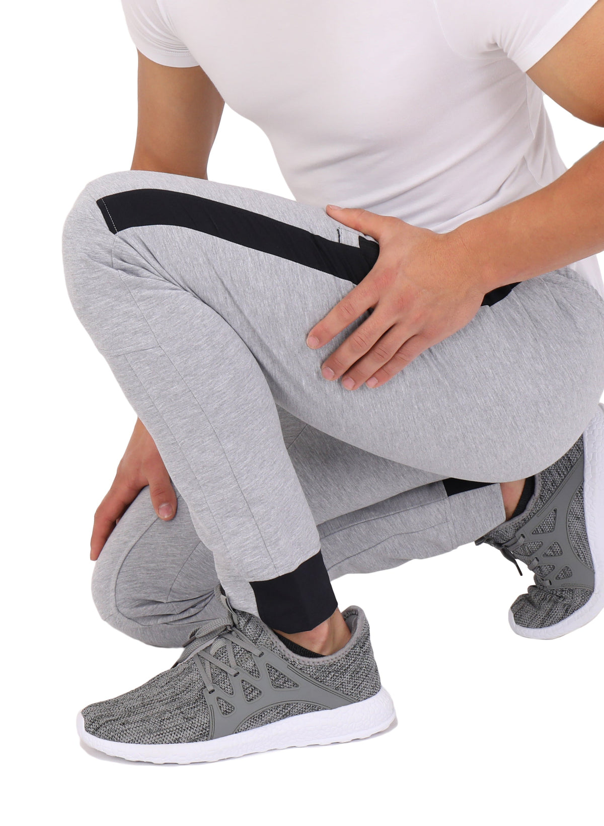 Tall fit jogger pants in light grey with black side panels and elastic waistband.