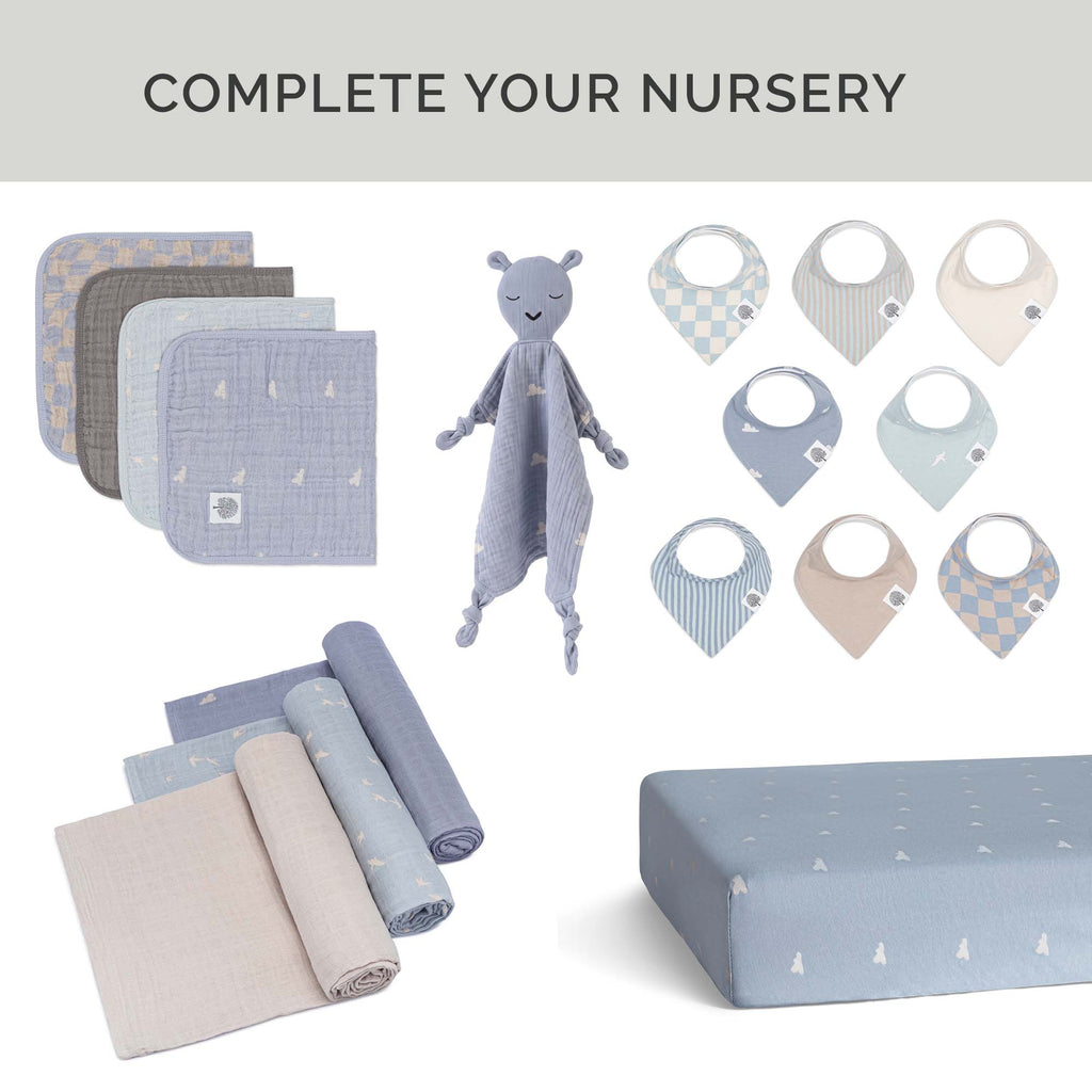 Crib sheet in periwinkle blue with tiny star print, folded with matching textures