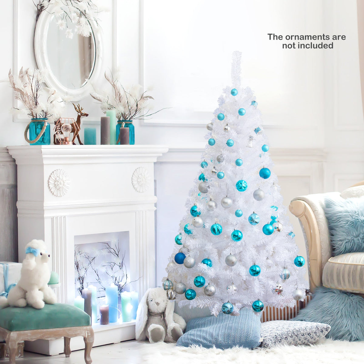 White artificial Christmas tree with blue bauble ornaments and a small snow-dusted look