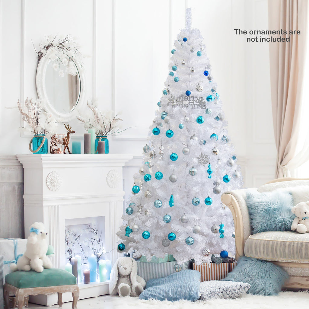 White artificial Christmas tree with blue ornament balls and snowy branch texture