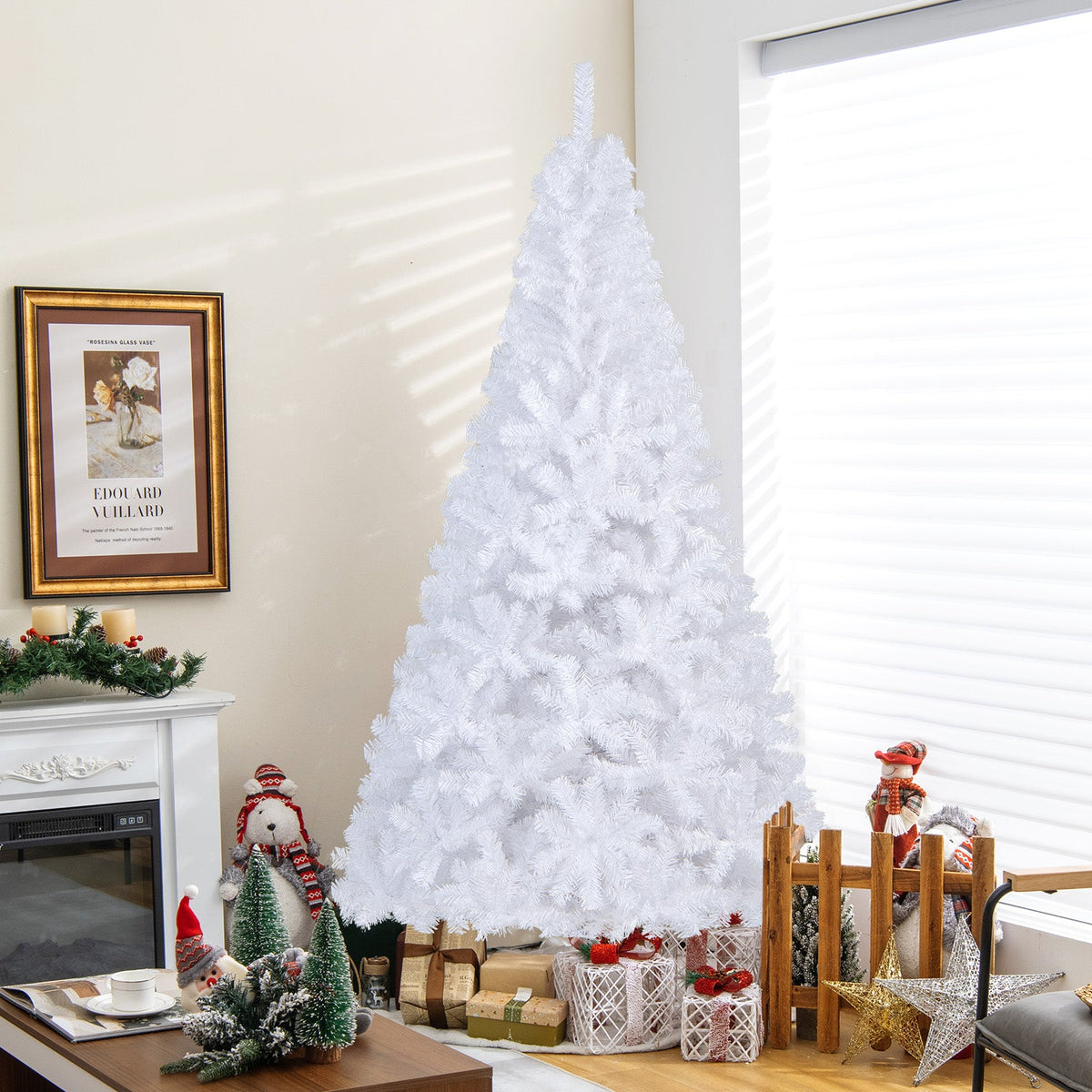 White artificial Christmas tree with stand in a room setting