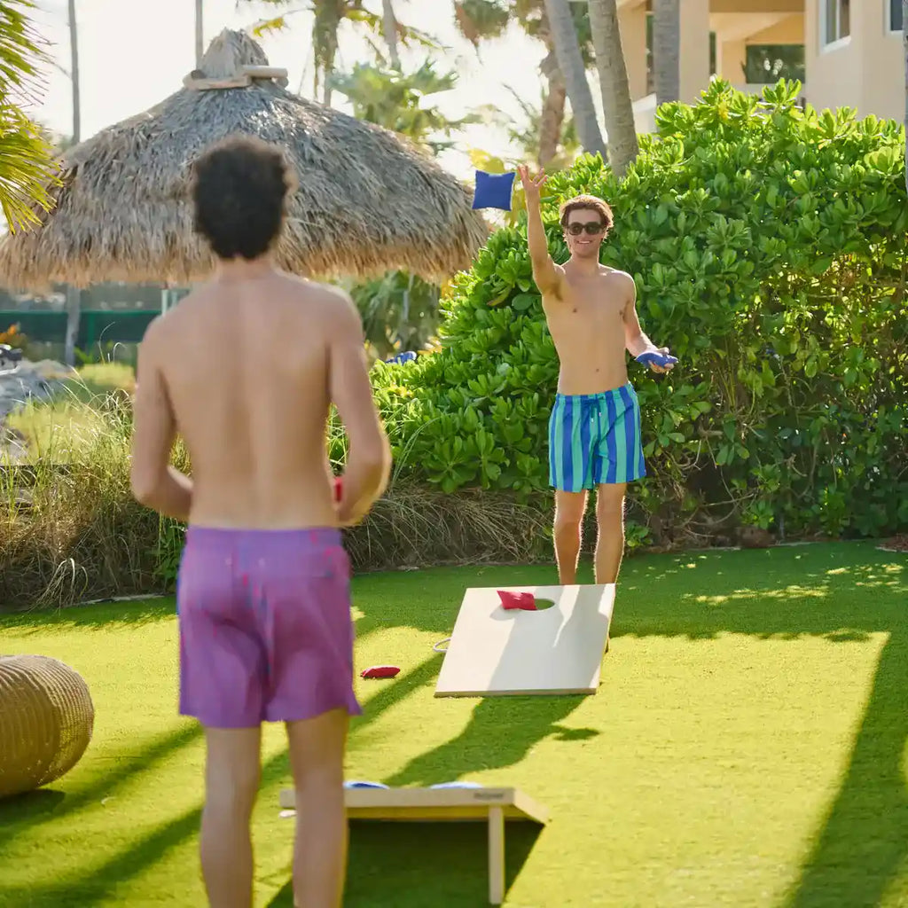 Blue and green striped swim trunks with drawstring waistband