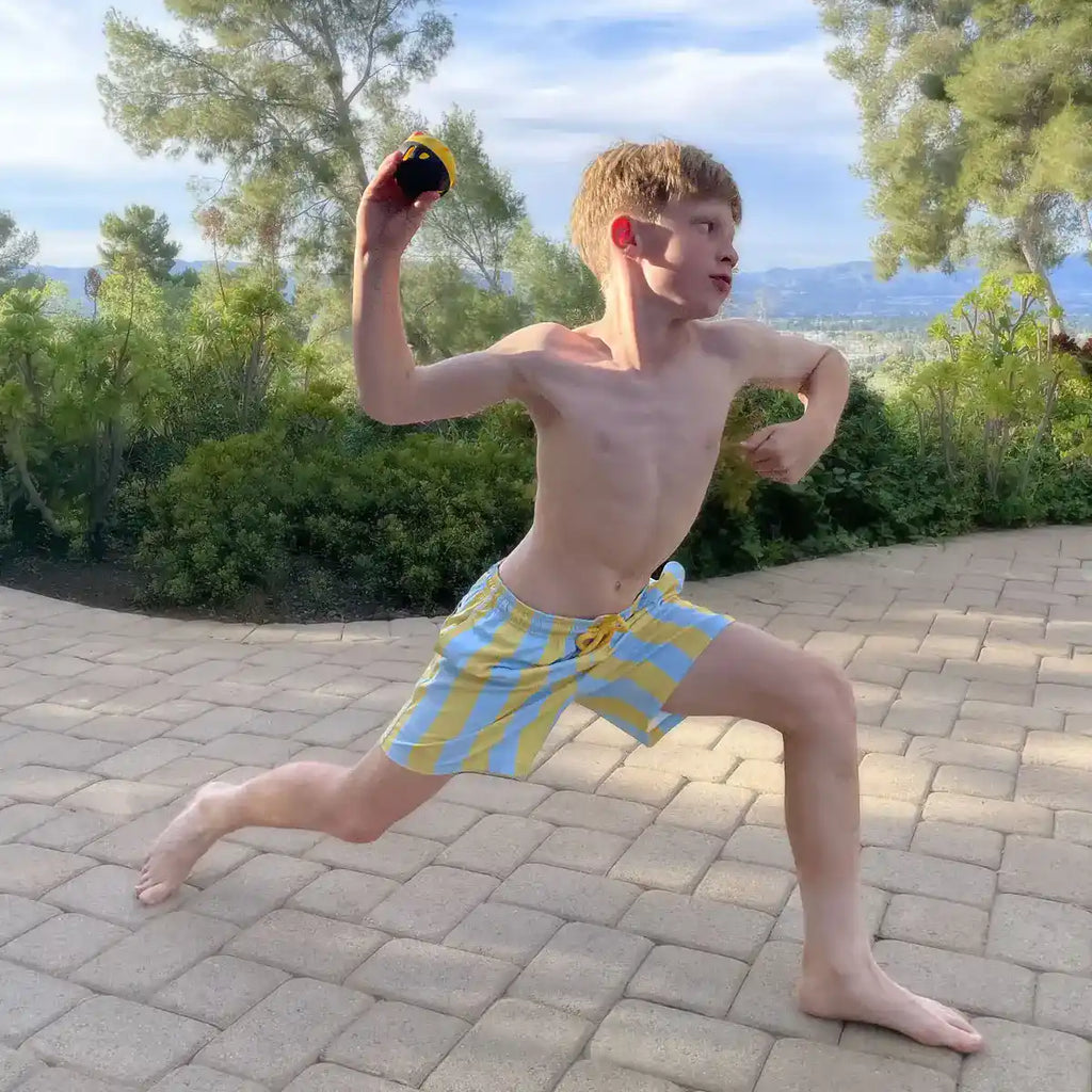 Boys swim and play trunks, light blue and yellow vertical stripes, tie-front drawstring