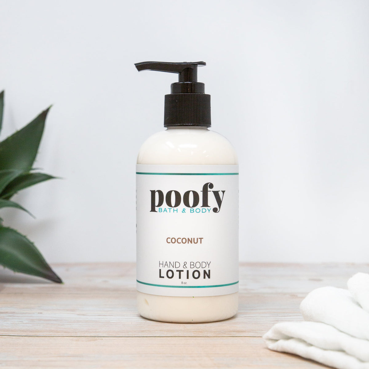 Coconut hand and body lotion bottle with pump, white bottle and teal label