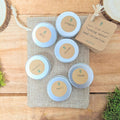 Herb seed collection tins with oregano, thyme, chives, oregano, basil labels