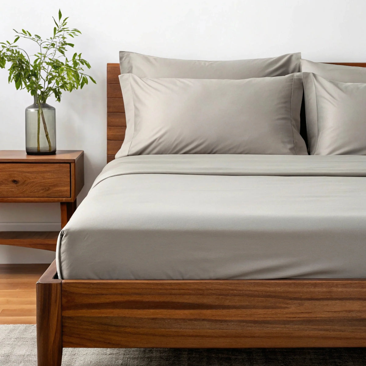 Copper-infused bamboo sheet set in light gray-white with two pillowcases.