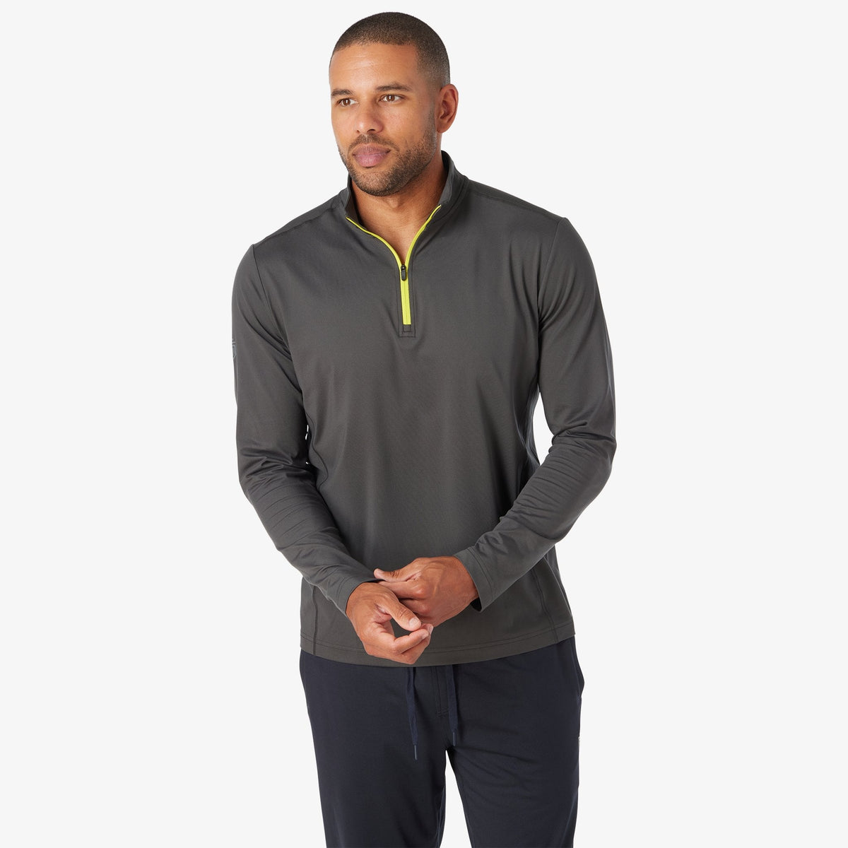 Charcoal quarter-zip tech pullover with neon yellow zipper and long sleeves