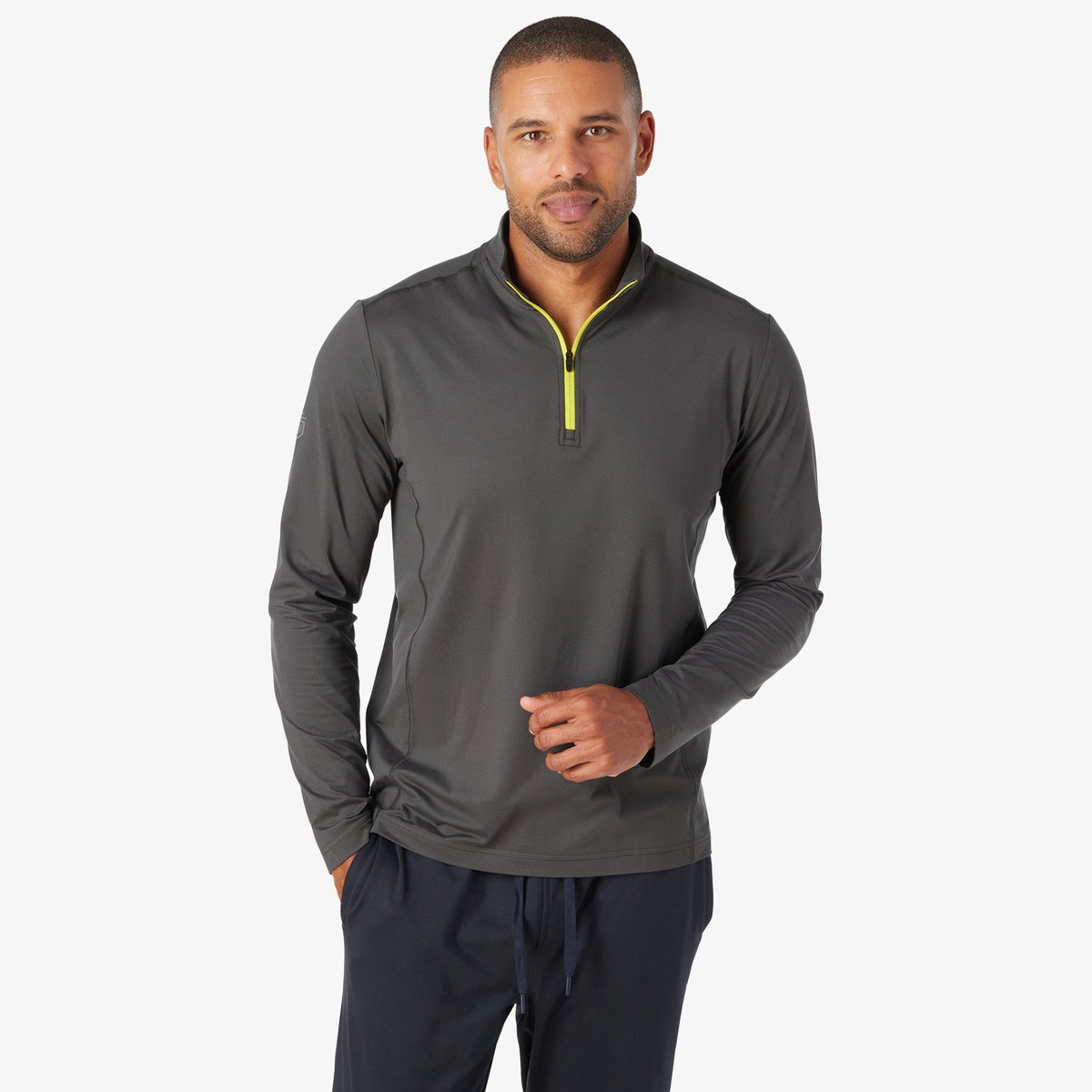 Charcoal quarter-zip tech pullover with neon yellow zipper and stand collar