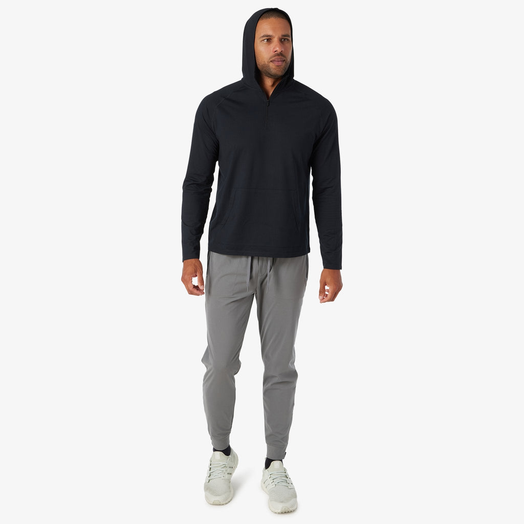 Black quarter-zip hooded pullover with long sleeves and attached hood